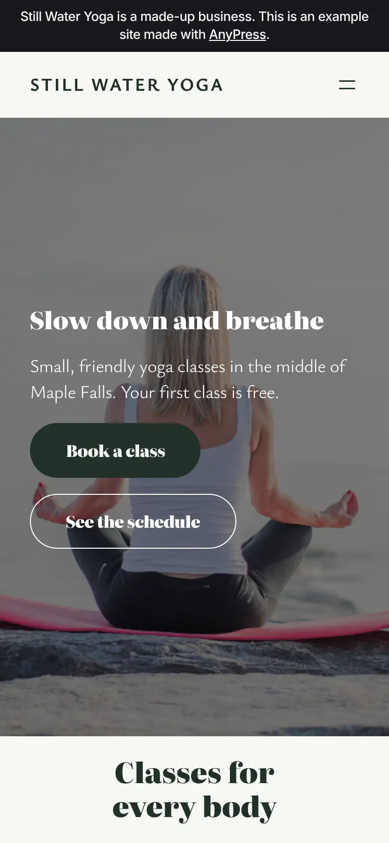 The Still Water Yoga example site on a phone